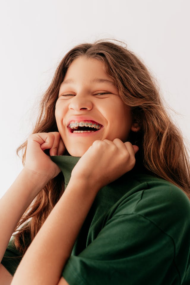 Girl with braces smile happily