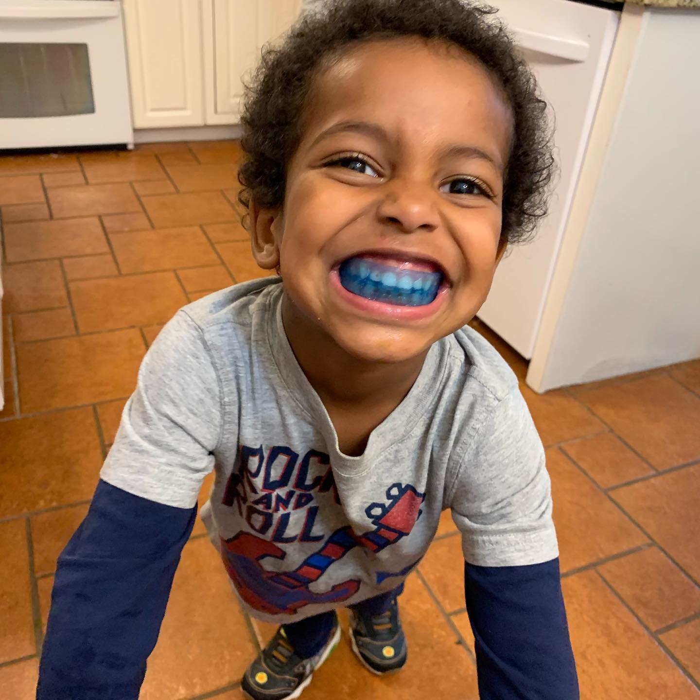 a child wearing a blue myobrace