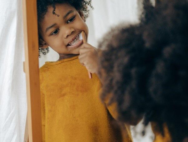 a child brush her teeth